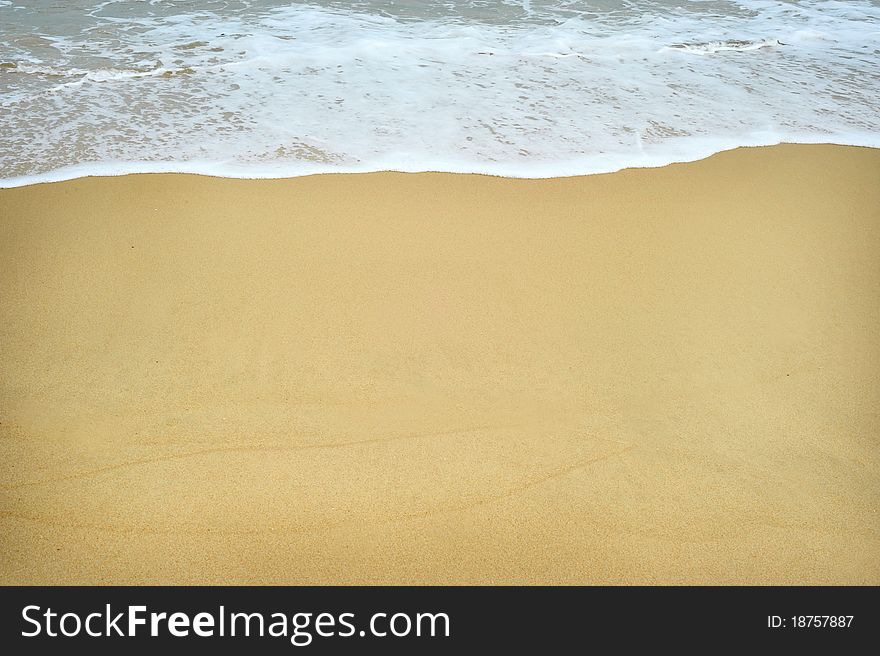 White foam on a beach - background texture. White foam on a beach - background texture