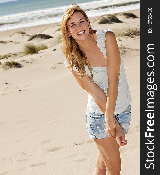 Young woman at the beach on a sunny day. Young woman at the beach on a sunny day