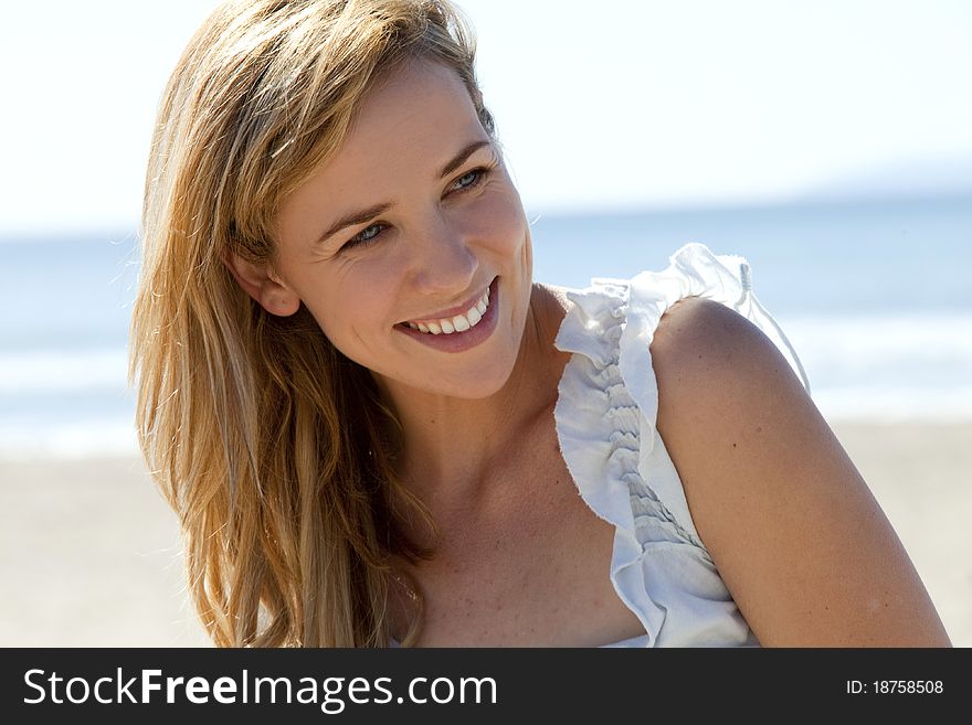 Young woman at the beach on a sunny day. Young woman at the beach on a sunny day