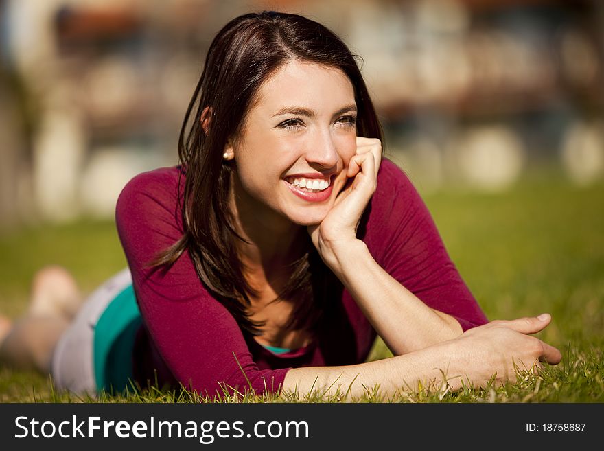 Pretty girl sitting in the grass. Pretty girl sitting in the grass