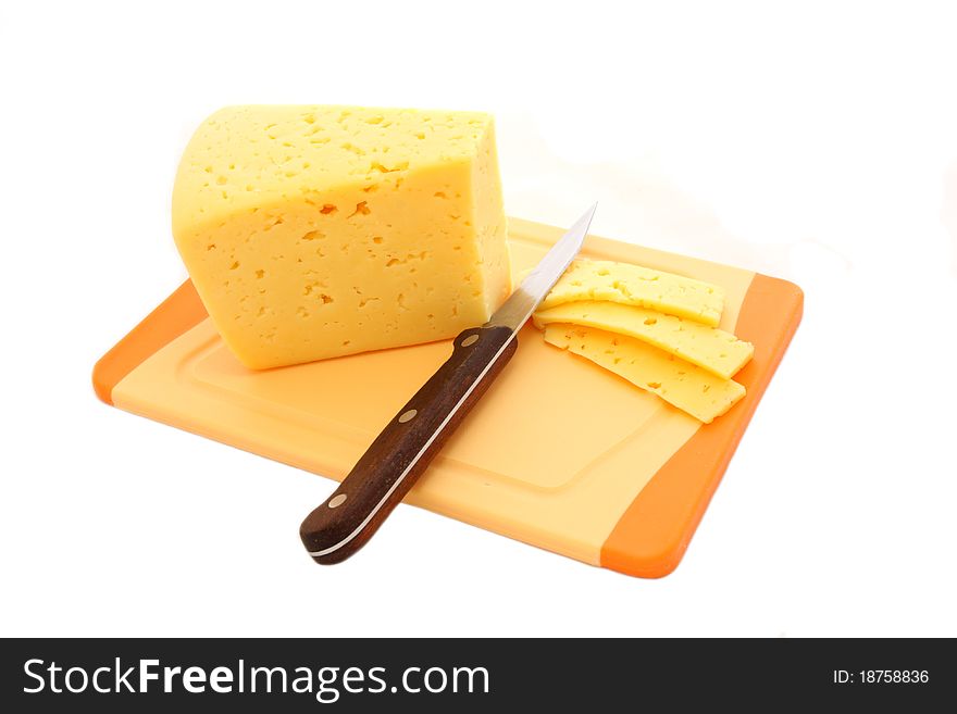 Cheese cutting on a chopping board