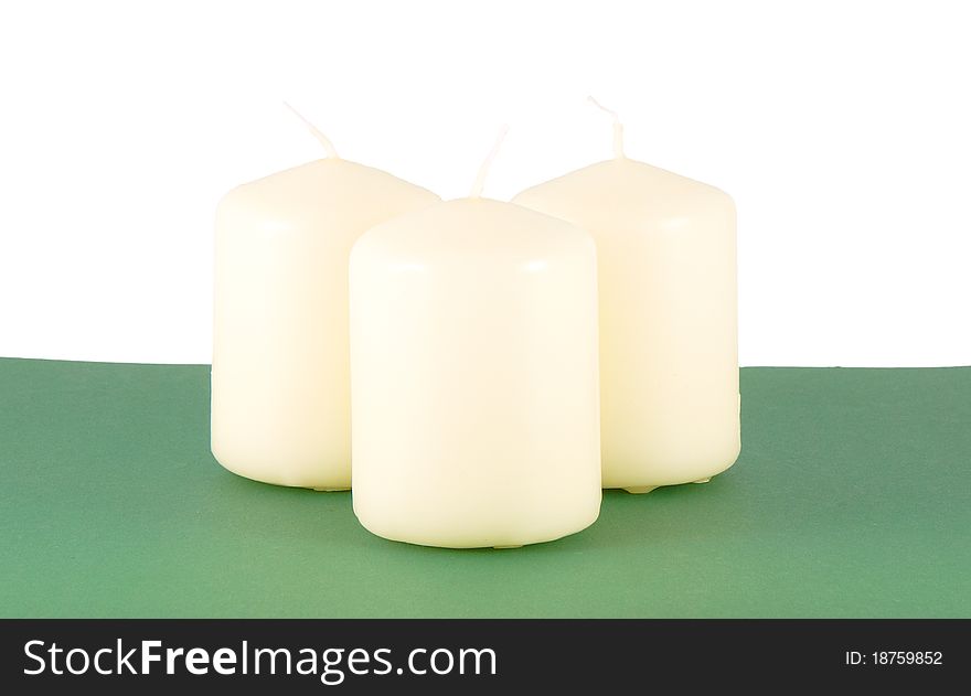 Set of candles on a green background