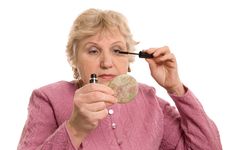 The Elderly Woman Does A Make-up Royalty Free Stock Photos The Elderly Woman Does A Make-up Royalty Free Stock Photos