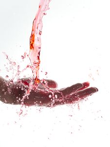 Red Water Falling On Hand Royalty Free Stock Photography Red Water Falling On Hand Royalty Free Stock Photography