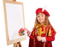 Girl With A Brush And Paints Near An Easel Stock Photo