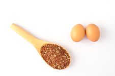 Brown Egg And Wooden Spoon With Red Rice Stock Image