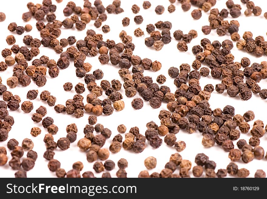 Black Peppercorns close up as background