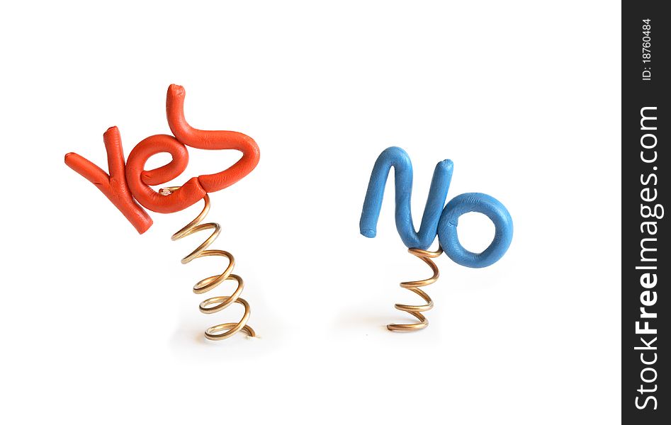 Words Yes and No made from plasticine attached to metal springs on white background. Words Yes and No made from plasticine attached to metal springs on white background