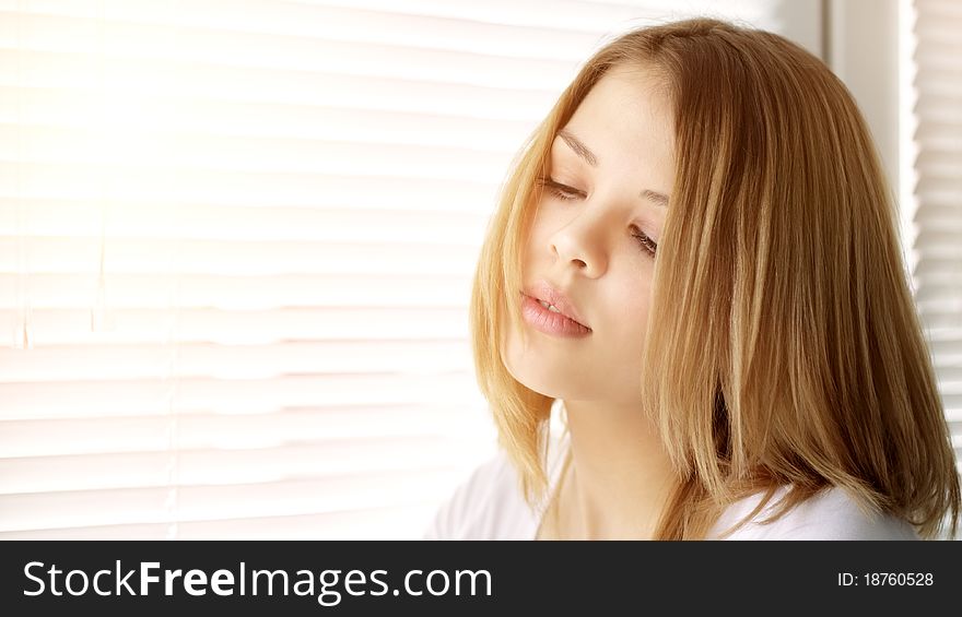 Portrait of attractive girl on a light background