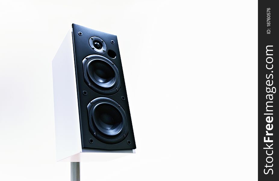 An audio speaker on white background low point view. An audio speaker on white background low point view