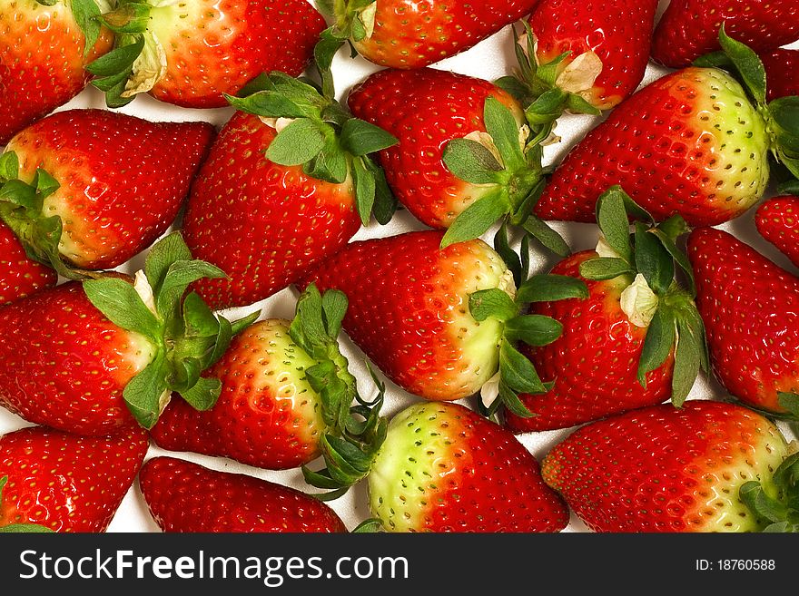 Fresh and appetizing strawberries lying evenly
