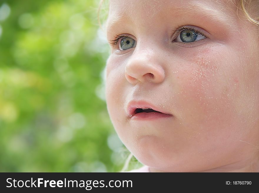 Close up child portrait on natural background