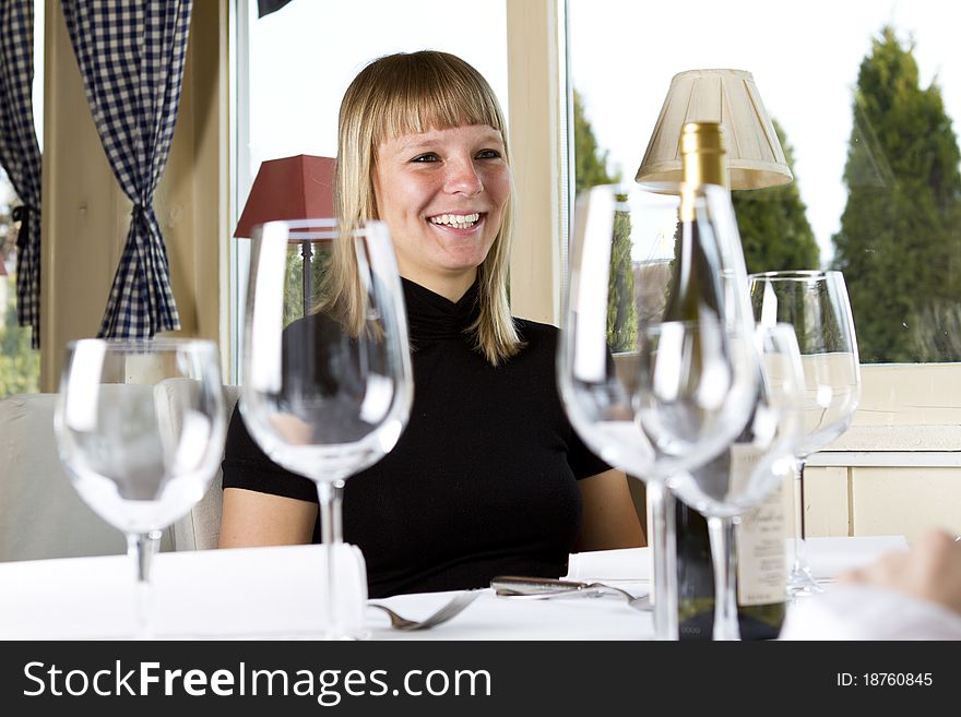 Young girls having dinner in fancy restaurant at the table