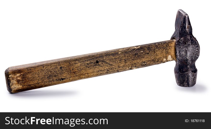 Old shabby working hammer of handwork on the wooden handle