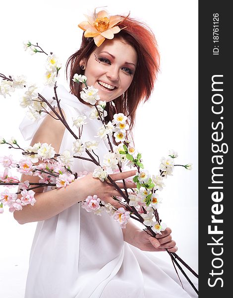 Portrait of beautiful woman with spring flowers on white. Portrait of beautiful woman with spring flowers on white