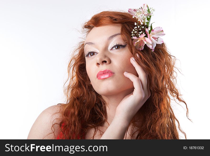 Portrait of beautiful woman with spring flowers on white