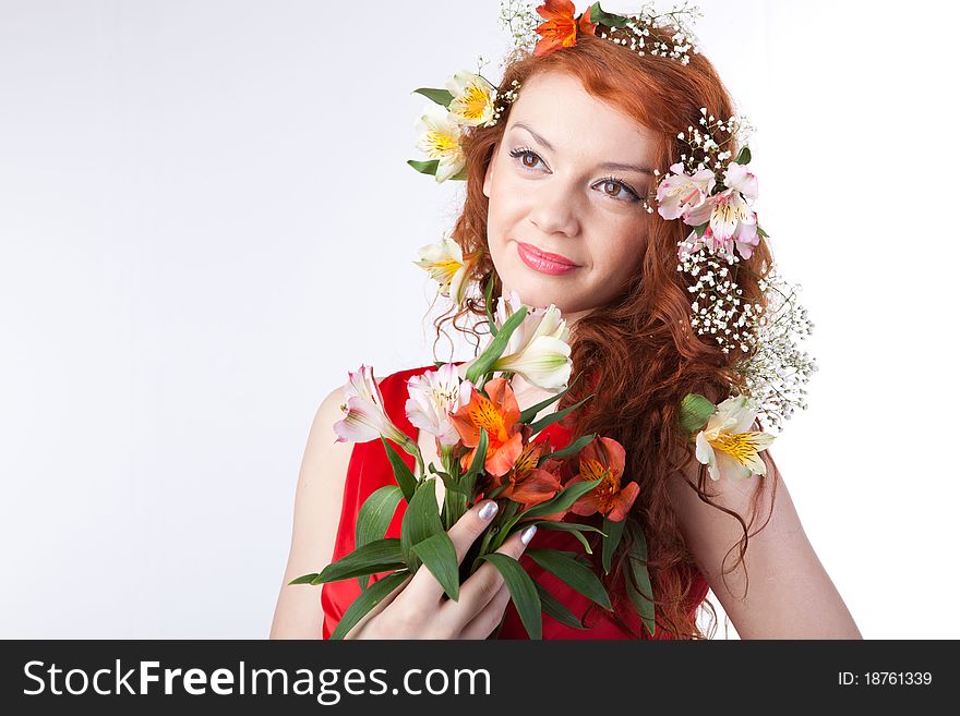 Portrait of beautiful woman with spring flowers