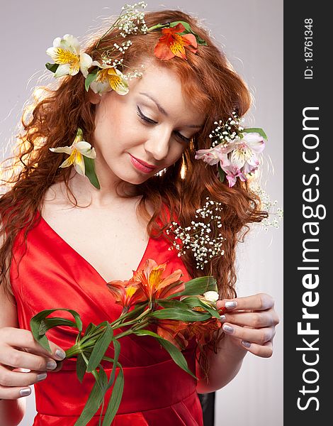 Portrait of beautiful woman with spring flowers