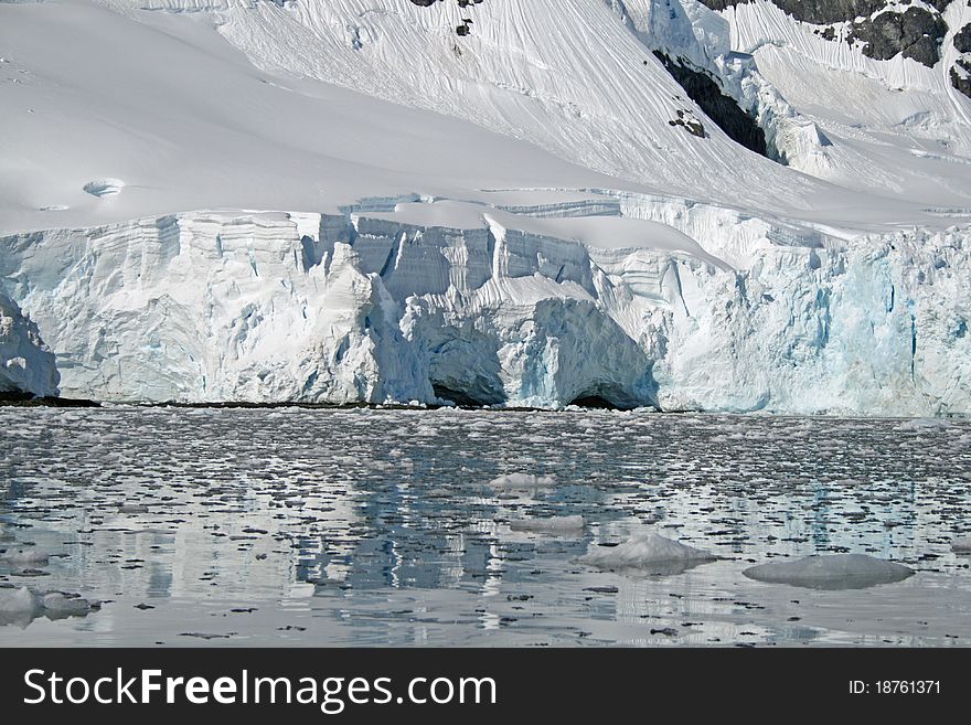 Antarctic glacier ice sheet meeting sea. Antarctic glacier ice sheet meeting sea