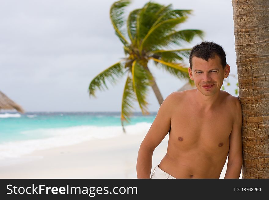 Young Man On A Tropical Beach