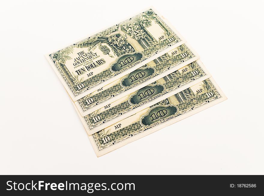 Four ten dollar japanese notes displayed