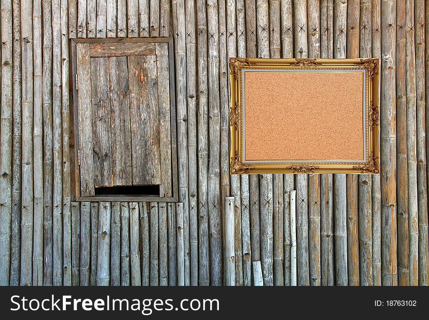 Cork board with vintage frame hanging on bamboo panal. Cork board with vintage frame hanging on bamboo panal