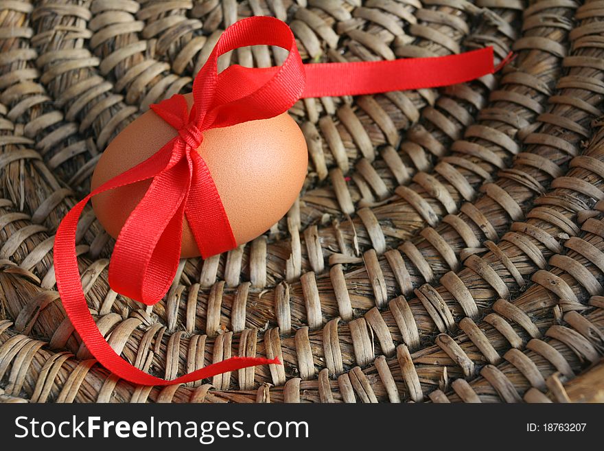 Easter egg with red ribbon