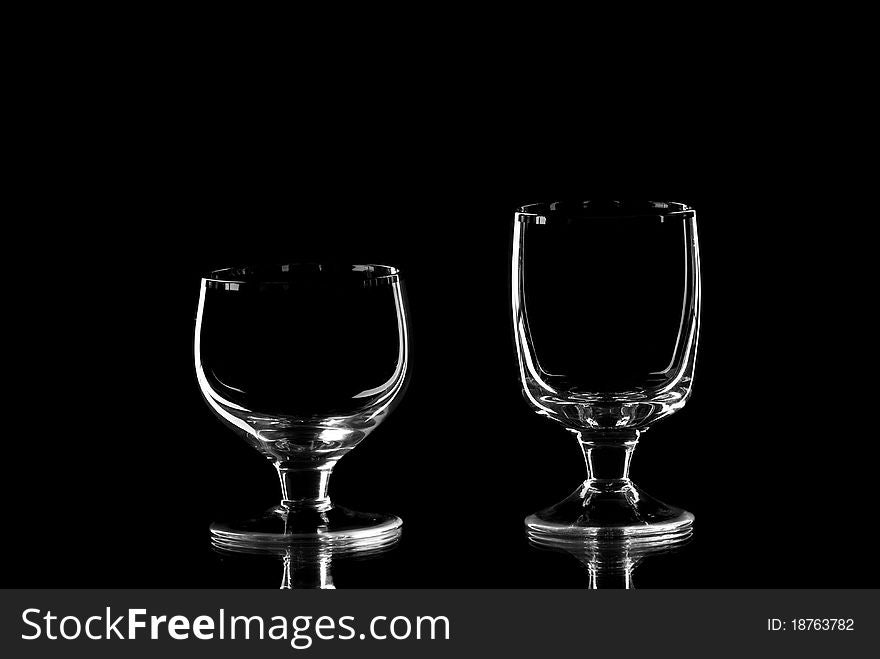 Two empty wine glasses. Blackbackground. Studio shot.