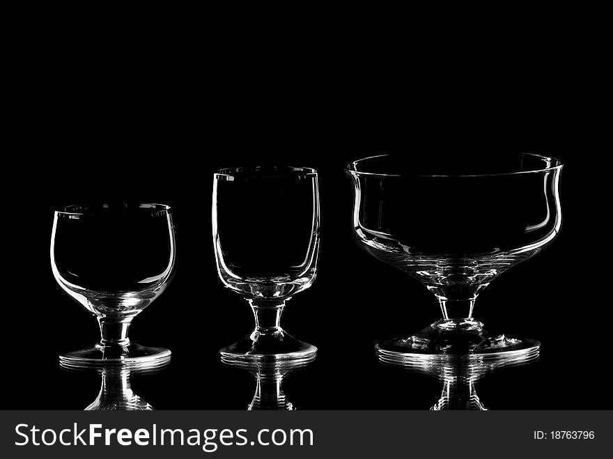 Set of empty wine glasses. Black background. Studio shot.