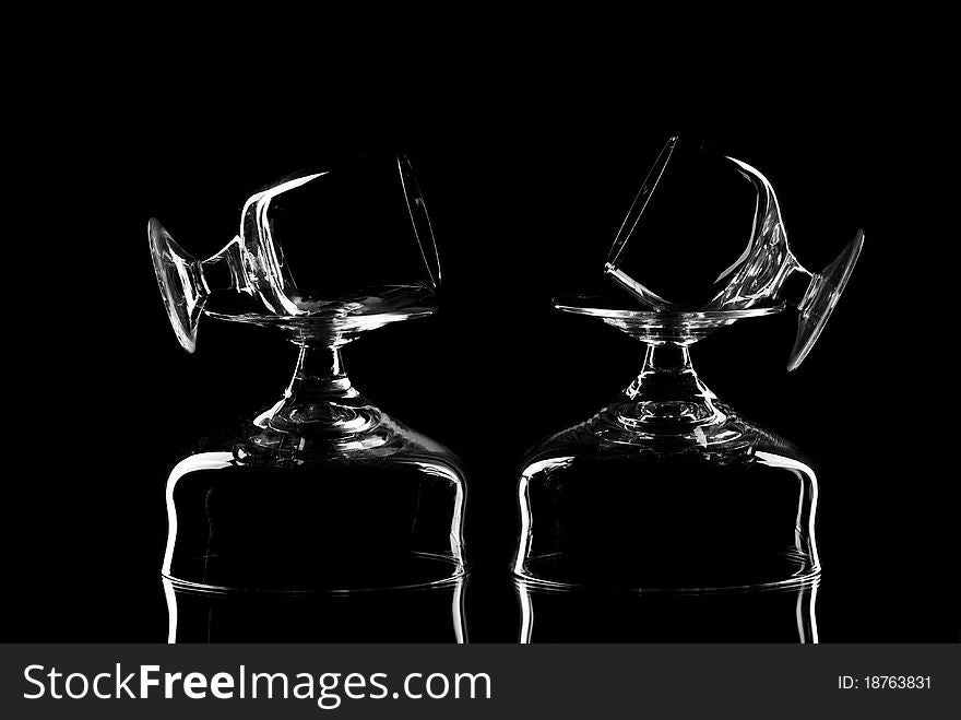 Set of empty wine glasses. Black background. Studio shot. Set of empty wine glasses. Black background. Studio shot.