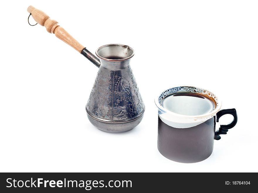 Cup of coffee and metal coffee pot