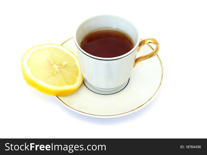 White cup of tea isolated on white with lemon. White cup of tea isolated on white with lemon
