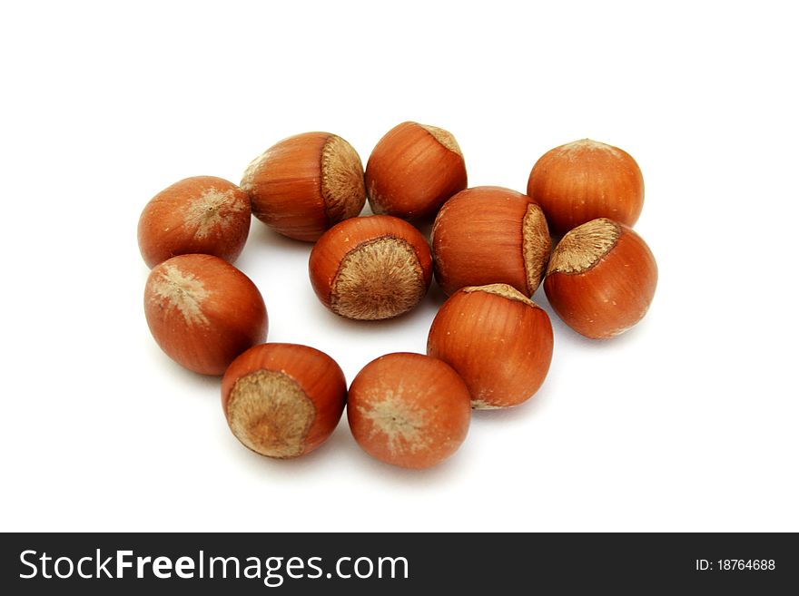 Shot of hazelnuts isolated on white background