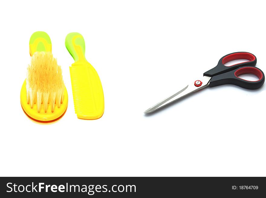 Photo of the scissors and combs on white background