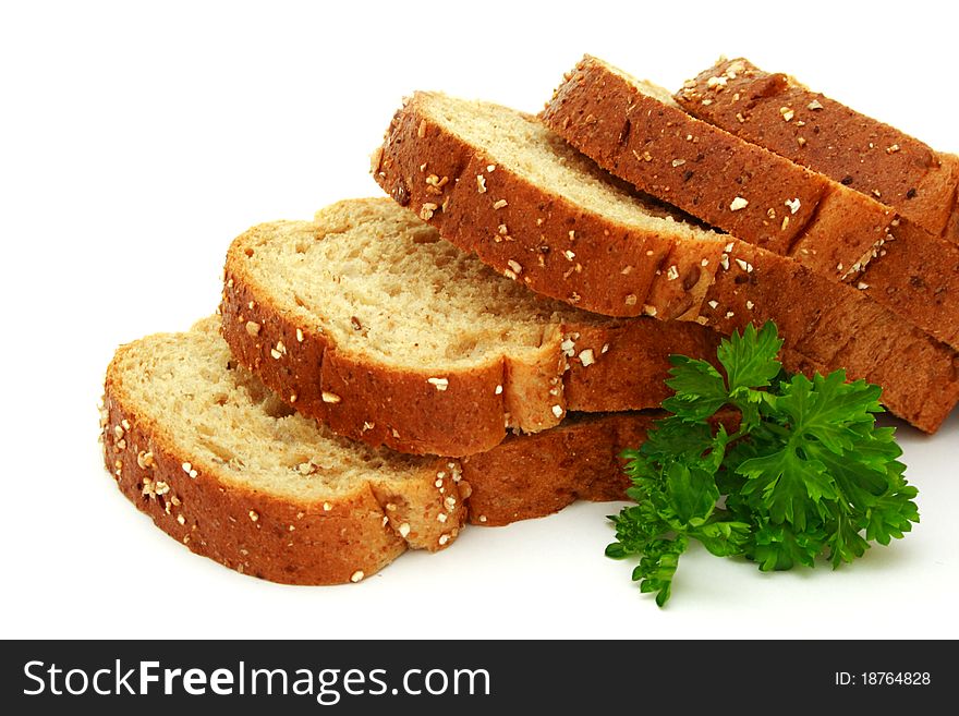 Fresh bread with parsley isolated on white