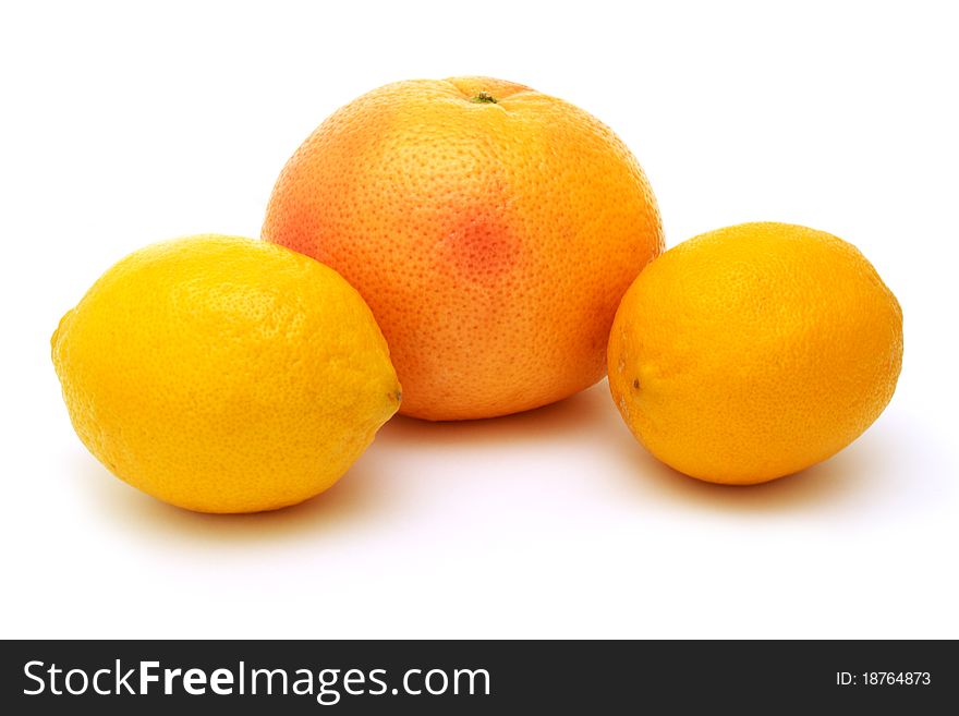 Two lemons and grapefruit isolated on white