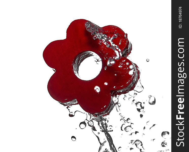 Splashing water on red flower's shape. Splashing water on red flower's shape