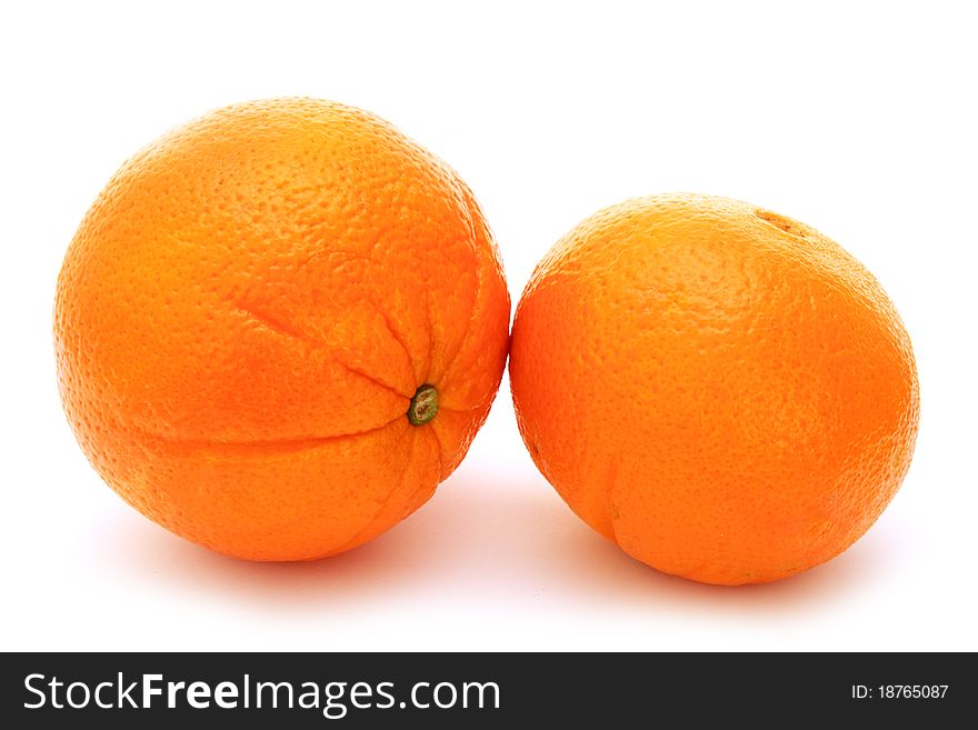Two fresh oranges isolated on white background