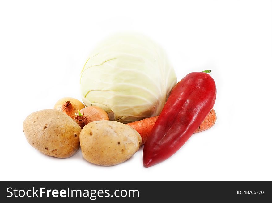 Cabbage, carrots, potatoes, onions and peppers isolated on white background. Cabbage, carrots, potatoes, onions and peppers isolated on white background