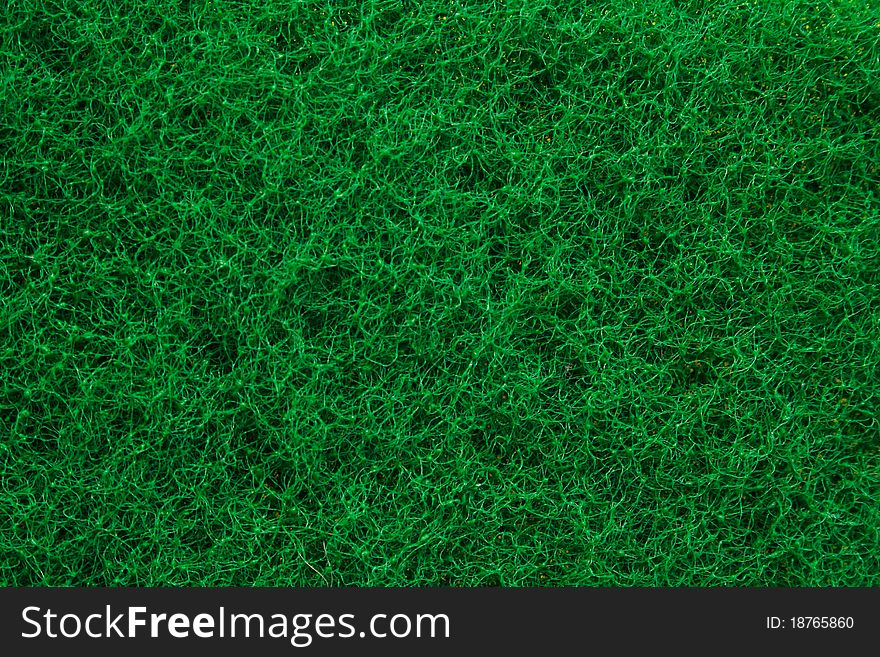 Green abrasive sponge texture background like grass