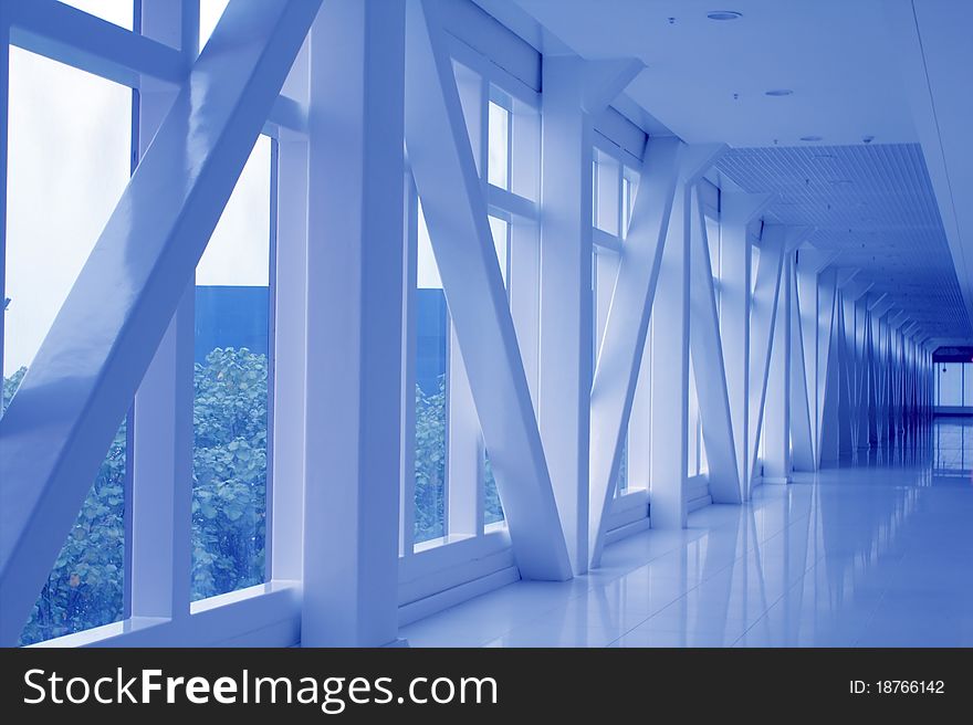 Modern business building interior with large glass facade and concrete. Modern business building interior with large glass facade and concrete
