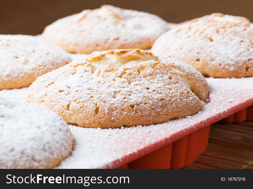 Muffins with a sugar powder in a silicon mold