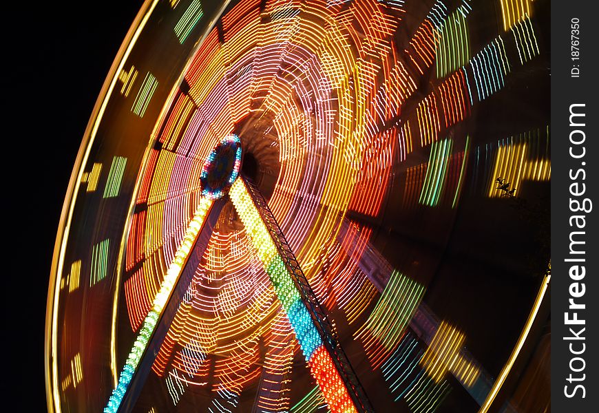 Ferries wheel spinning at night. Ferries wheel spinning at night