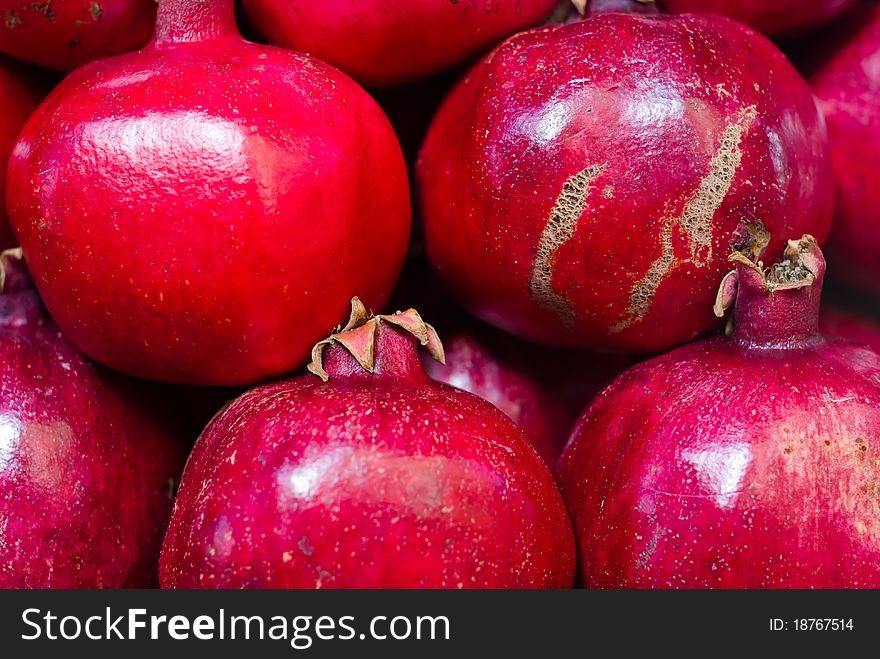 Red pomegranates at the old market of Acre in Israel