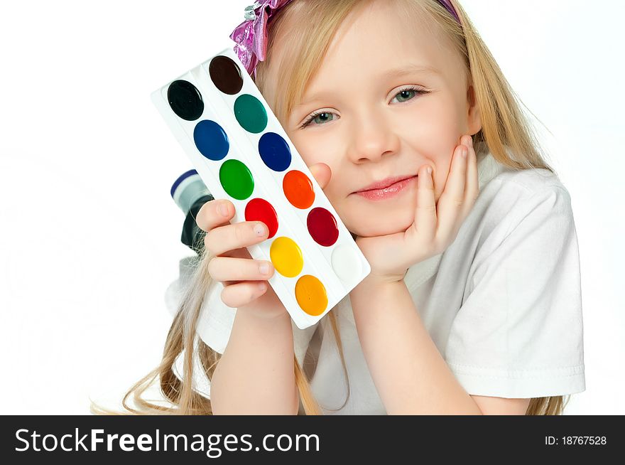 Cute little girl with paints