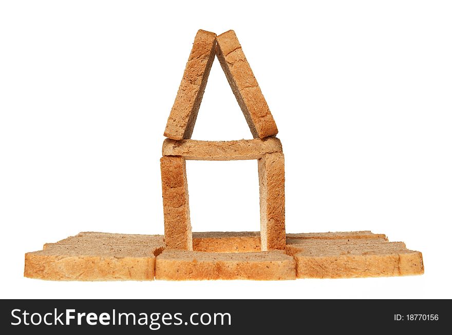 House from bread on a white background