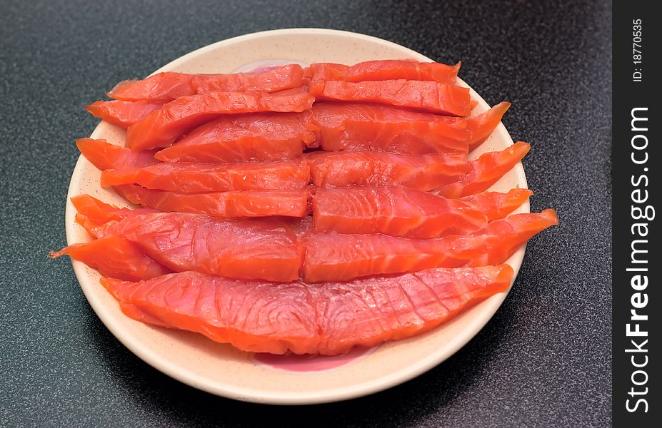 Fresh wild salmon fish fillet steaks on a plate. Fresh wild salmon fish fillet steaks on a plate