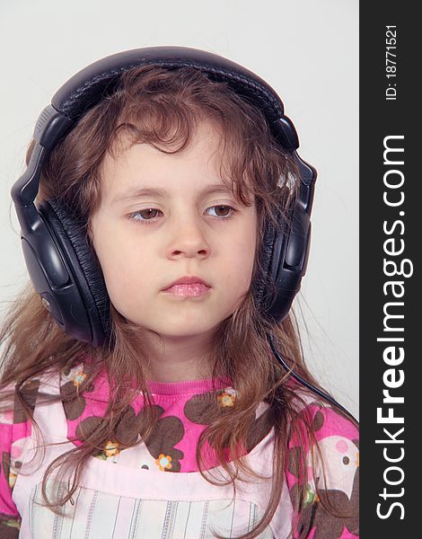 A small girl and headphones