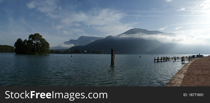 The Alpine landscape, lake in mountains, a fog over lake, morning In Ð°Ð»ÑŒÐ¿Ð°Ñ…, the French landscape