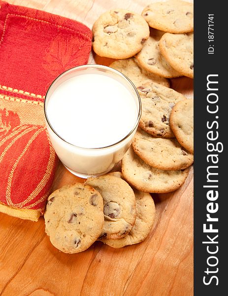 Chocolate chip cookies and a glass of milk. Chocolate chip cookies and a glass of milk